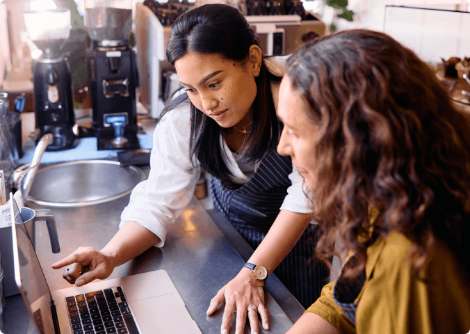 Business owners reviewing security on a laptop